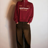 Sudadera oversize con media cremallera y cuello alto estampada con letras