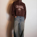 Sudadera oversize con media cremallera y cuello alto estampada con letras