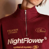 Sudadera oversize con media cremallera y cuello alto estampada con letras
