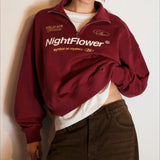 Sudadera oversize con media cremallera y cuello alto estampada con letras