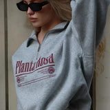 Sudadera casual de cuello convertible con estampado de letras y media cremallera