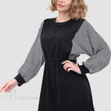 Vestido de manga larga con cintura elástica.