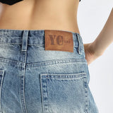 Vaqueros bootcut de tiro bajo y largo hasta el suelo