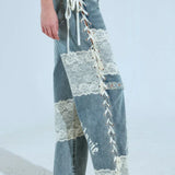 Elegantes jeans de pierna recta con cintura baja y panel de encaje.
