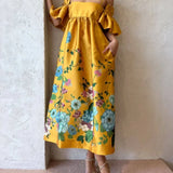 Vestido midi de corte A con mangas fruncidas y elegantes bolsillos, estampado caléndula, con bolsillos.