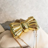 Mini bolso bandolera de metal con pajarita para noche o boda