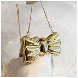 Mini bolso bandolera de metal con pajarita para noche o boda