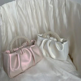 Clutch de noche con asa de cuentas