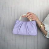 Clutch de noche con asa de cuentas