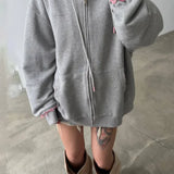 Sudadera con capucha, cremallera y corte holgado en color rosa descolorido