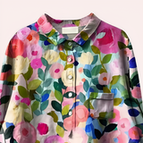Blusa de mujer – Corte holgado – Fibras naturales transpirables – Estampado floral – Mangas largas – Tapeta de botones – Cuello clásico