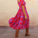 Vestido midi estampado con mangas abullonadas y un encantador escote cuadrado