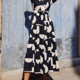 Vestido midi con mangas abullonadas y escote en pico, encantador estampado geométrico