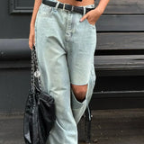 Vaqueros retro descoloridos con piernas anchas y rectas, hasta el suelo.