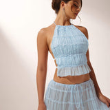 Conjunto de mujer: top plisado con espalda descubierta, top corto con cuello halter y falda larga acampanada