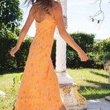 Vestido lencero con volantes y escote pronunciado