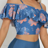 Conjunto de dos piezas con estampado floral, espalda abierta y tirantes con volantes.