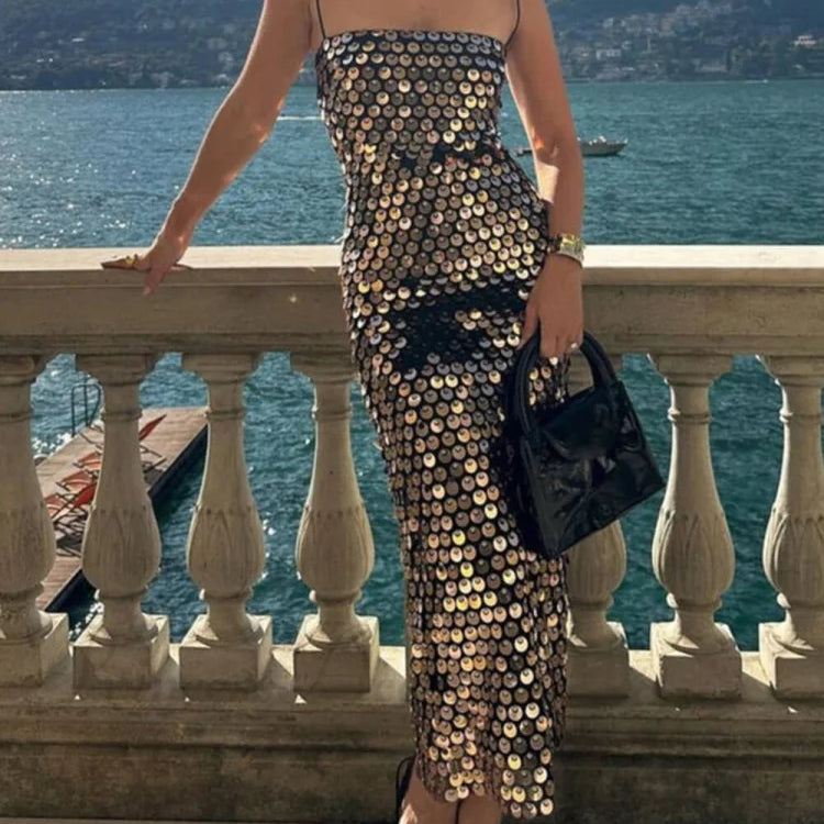 Vestido midi asimétrico con lentejuelas, elegante y versátil.