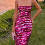 Vestido midi asimétrico con lentejuelas, elegante y versátil.
