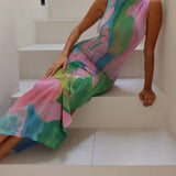 Vestido midi sexy sin mangas con espalda descubierta, elegante y con aberturas laterales.