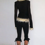 Blusa corta con mangas largas y cuello de piel, paneles de tul y un escote elegante y sexy.