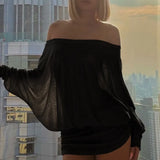 Blusa sexy lisa con mangas de murciélago y diseño de hombros descubiertos.