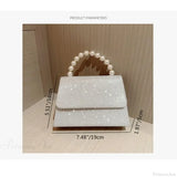 Clutch de noche de seda con cadena de perlas doradas