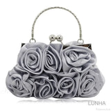 Clutch de noche con marco floral en rosa de seda.
