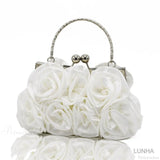 Clutch de noche con marco floral en rosa de seda.