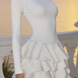 Vestido mini liso, abullonado, con cuello redondo y cintura alta.