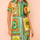 Elegante vestido midi con un estampado especial de girasoles.