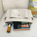 Bolso tote casual con estampado de estrellas estilo años 2000 y correa para el hombro.