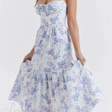 Elegante vestido midi floral con tirantes y bajo asimétrico.