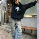 Pantalones cargo de mezclilla con parches y bolsillos estilo streetwear