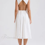 Vestido midi moderno, elegante y a la moda en color liso con cuello redondo, espalda abierta y sin mangas.