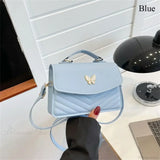Elegante bolso de mano en piel sintética bordado con mariposas.