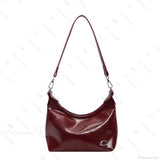 Elegante bolso de hombro de PU con cremallera.