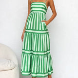 Vestido midi con tirantes, espalda abierta, rayas, estampado elegante y bolsillos.