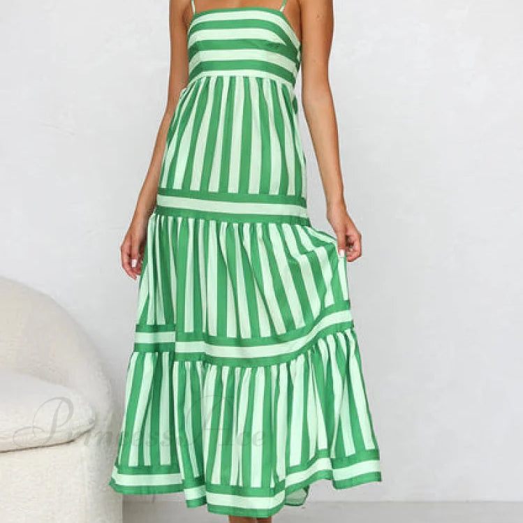 Vestido midi con tirantes, espalda abierta, rayas, estampado elegante y bolsillos.