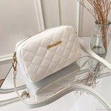 Bolso de hombro para cámara con pompones bordados