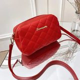 Bolso de hombro para cámara con pompones bordados