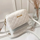 Bolso de hombro para cámara con pompones bordados