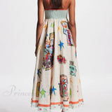 Vestido midi largo y elegante con tirantes y un estampado de grafiti único.