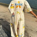Vestido midi con estampado floral único y mangas abullonadas, estilo folk, ideal para fiestas.