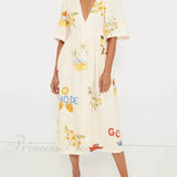 Vestido midi con estampado floral único y mangas abullonadas, estilo folk, ideal para fiestas.