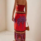 Vestido midi floral con hombros descubiertos adornado con una palmera única y encantadora.
