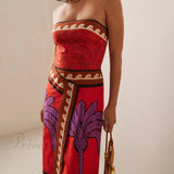 Vestido midi floral con hombros descubiertos adornado con una palmera única y encantadora.