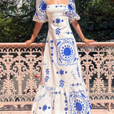 Elegante vestido midi con mangas abullonadas para las fiestas.