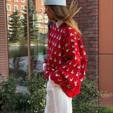 Blusa roja versátil en punto jacquard con bloques de color