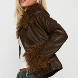 Chaqueta vintage con cuello polar y paneles de cuero.